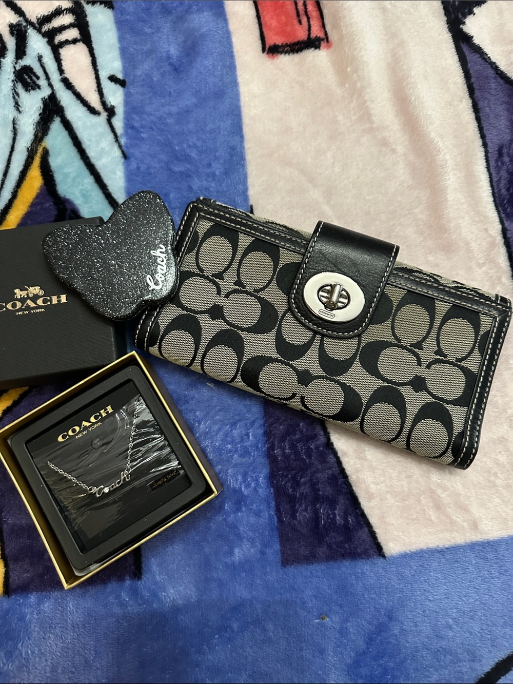 Coach Signature Jacquard Turnlock Wallet in Black and Gray, mirror and necklace